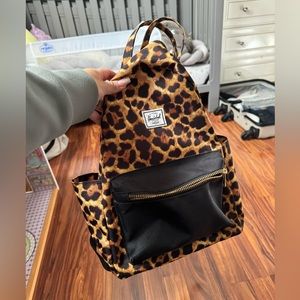 Leopard print Herschel backpack 11 x 14 inches approximate size.